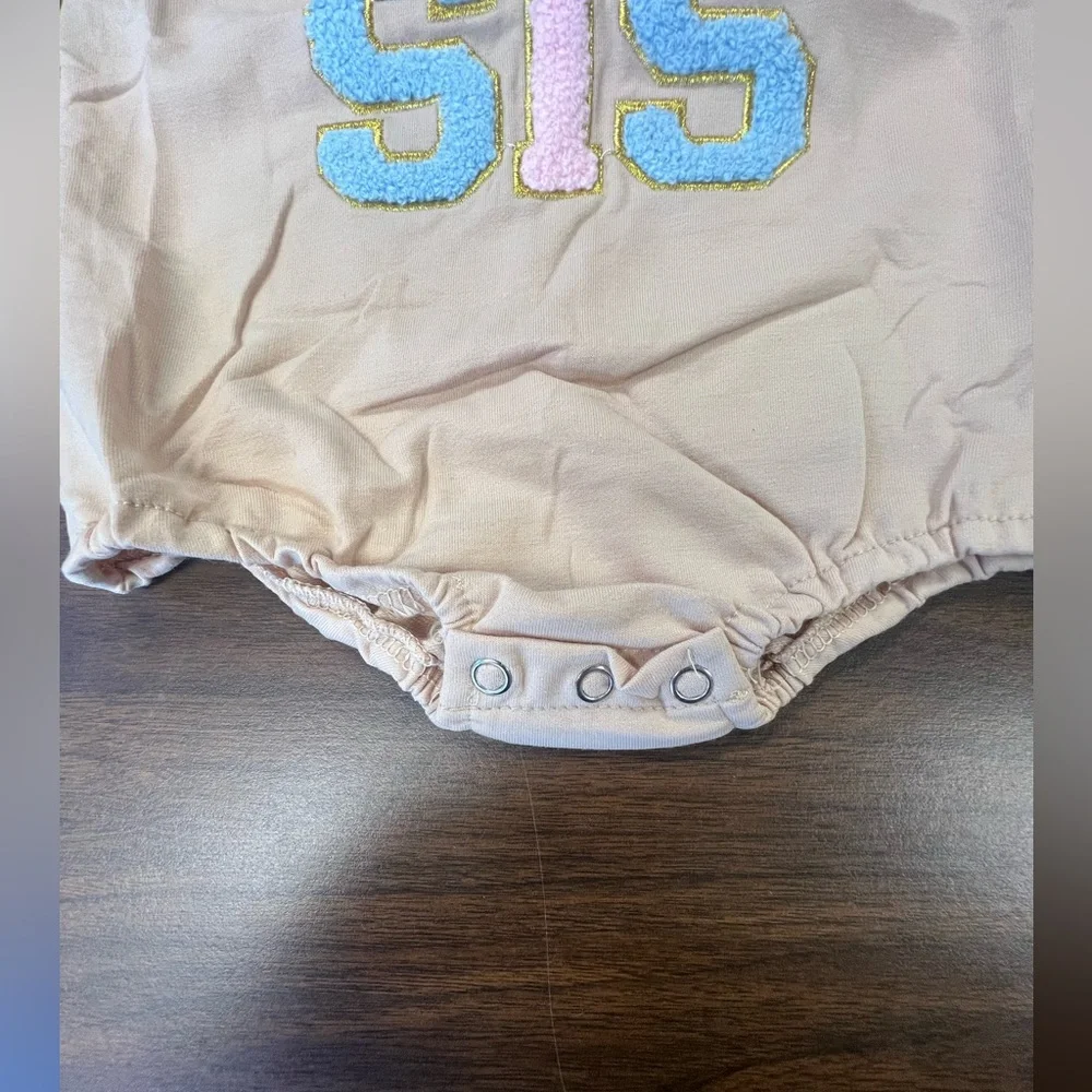 Lil Sis Baby Onesie in Cream with Colorful Letters. Size 3-6 months